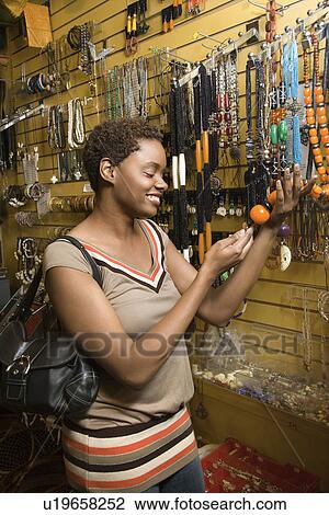 Young Woman Shopping For Jewelry View Large Photo Image Stock Image - Young Woman Shopping For Jewelry. Fotosearch