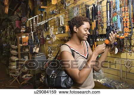 Young Woman Shopping For Jewelry View Large Photo Image Stock Photo - Young Woman Shopping For Jewelry. Fotosearch