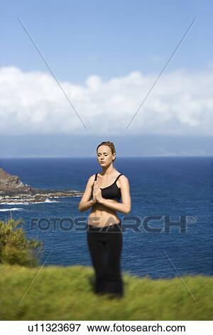 Young Woman Standing in Meditation View Large Photo Image Stock Photo - Young Woman Standing in Meditation. Fotosearch