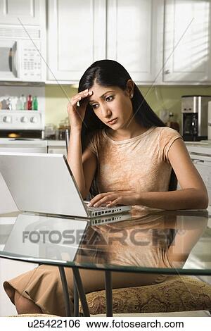 Stock Photograph - Young Woman Using Laptop. Fotosearch