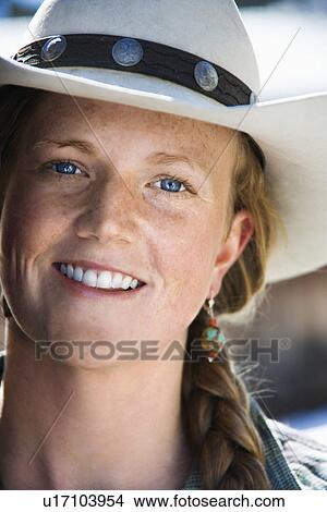 Picture - Young Woman Wearing Cowboy Hat. Fotosearch