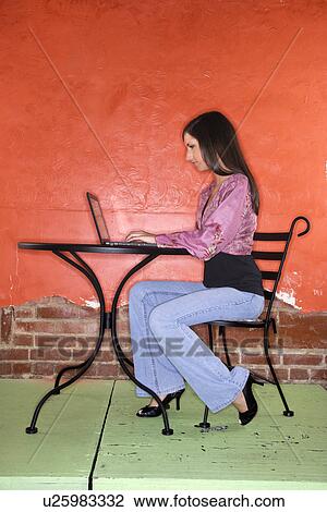 Stock Image - Young Woman with Laptop. Fotosearch