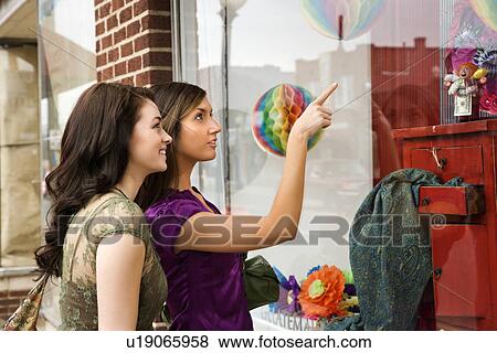 Stock Photo - Young Women Window Shopping. Fotosearch