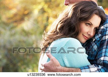 Close Up Of Romantic Couple Embracing By Autumn Woodland View Large Photo Image Stock Photograph - Close Up Of Romantic Couple Embracing By Autumn Woodland. Fotosearch
