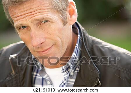 Close Up Portrait Of Man Standing Outside In Autumn Landscape View Large Photo Image Stock Image - Close Up Portrait Of Man Standing Outside In Autumn Landscape. Fotosearch