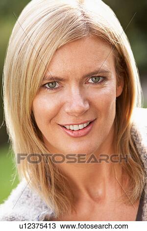 Close Up Portrait Of Smiling Blonde Woman Outdoors View Large Photo Image Stock Image - Close Up Portrait Of Smiling Blonde Woman Outdoors. Fotosearch