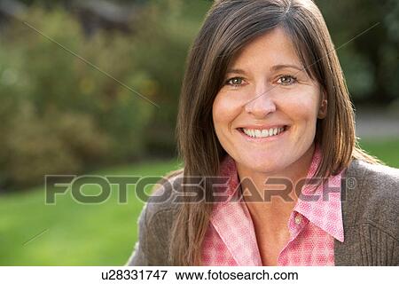 Close Up Portrait Of Smiling Brunette Woman Outdoors View Large Photo Image Stock Photo - Close Up Portrait Of Smiling Brunette Woman Outdoors. Fotosearch