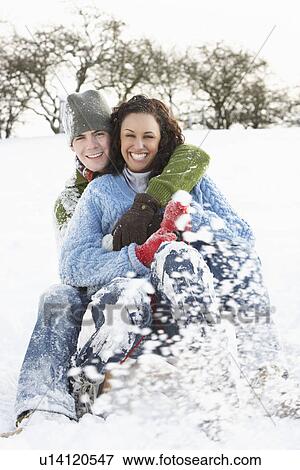 Couple Sledging Through Snowy Woodland View Large Photo Image Stock Photo - Couple Sledging Through Snowy Woodland. Fotosearch
