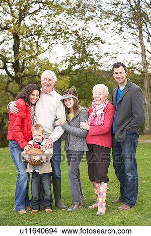 Picture - Extended Family Group On Walk Through Countryside. Fotosearch