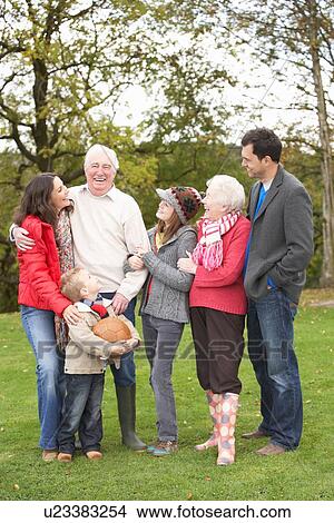 Picture - Extended Family Group On Walk Through Countryside. Fotosearch