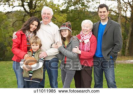 Stock Photography - Extended Family Group On Walk Through Countryside. Fotosearch