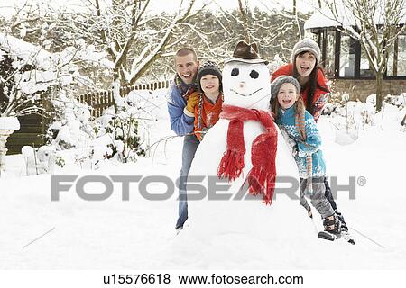 Family Building Snowman In Garden View Large Photo Image Stock Photo - Family Building Snowman In Garden. Fotosearch