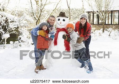Family Building Snowman In Garden View Large Photo Image Stock Photo - Family Building Snowman In Garden. Fotosearch