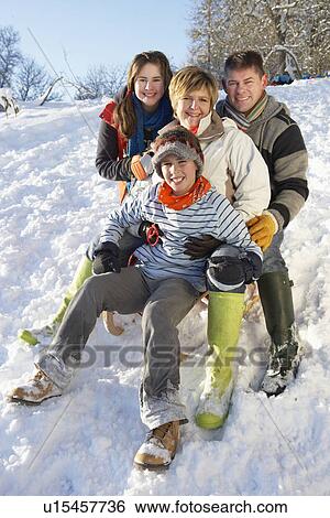Family Enjoying Sledging Down Snowy Hill View Large Photo Image Stock Photograph - Family Enjoying Sledging Down Snowy Hill. Fotosearch