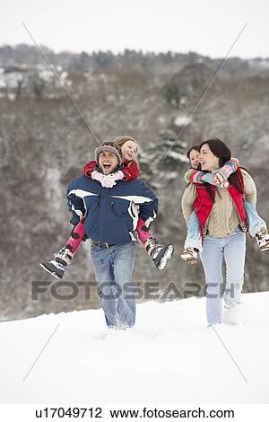 Family Having Fun In Snowy Countryside View Large Photo Image Stock Image - Family Having Fun In Snowy Countryside. Fotosearch