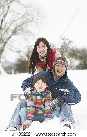 Family Having Fun In Snowy Countryside View Large Photo Image Stock Image - Family Having Fun In Snowy Countryside. Fotosearch