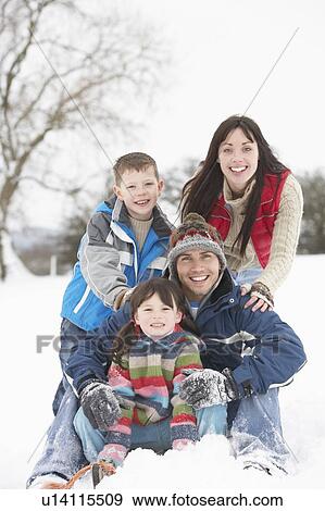 Family Having Fun In Snowy Countryside View Large Photo Image Stock Photo - Family Having Fun In Snowy Countryside. Fotosearch