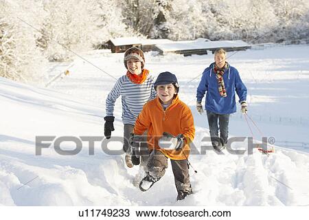 Father And Children Pulling Sledge Up Snowy Hill View Large Photo Image Stock Image - Father And Children Pulling Sledge Up Snowy Hill. Fotosearch