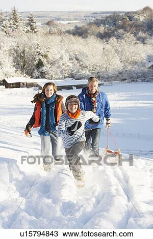 Father And Children Pulling Sledge Up Snowy Hill View Large Photo Image Stock Image - Father And Children Pulling Sledge Up Snowy Hill. Fotosearch