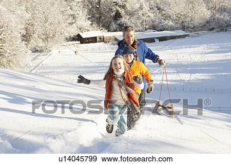 Father And Children Pulling Sledge Up Snowy Hill View Large Photo Image Stock Photo - Father And Children Pulling Sledge Up Snowy Hill. Fotosearch