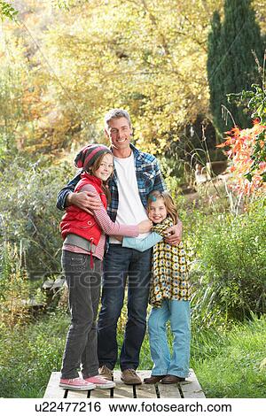 Father And Children Standing Outdoors On Wooden Walkway In Autumn Landscape View Large Photo Image Stock Photograph - Father And Children Standing Outdoors On Wooden Walkway In Autumn Landscape. Fotosearch