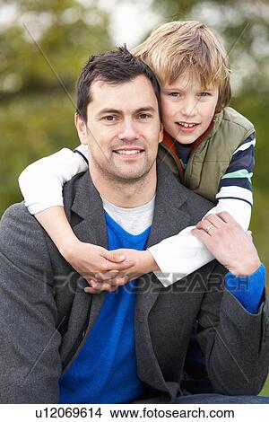 Father And Son Hugging On Outdoor Autumn Walk View Large Photo Image Picture - Father And Son Hugging On Outdoor Autumn Walk. Fotosearch