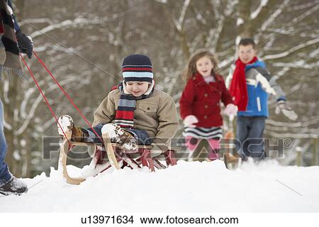 Father Pulling Children On Sledge Through Winter Landscape View Large Photo Image Picture - Father Pulling Children On Sledge Through Winter Landscape. Fotosearch