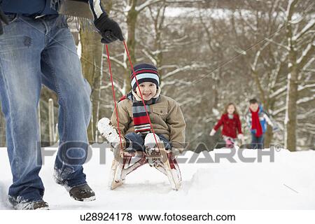 Father Pulling Children On Sledge Through Winter Landscape View Large Photo Image Stock Photo - Father Pulling Children On Sledge Through Winter Landscape. Fotosearch
