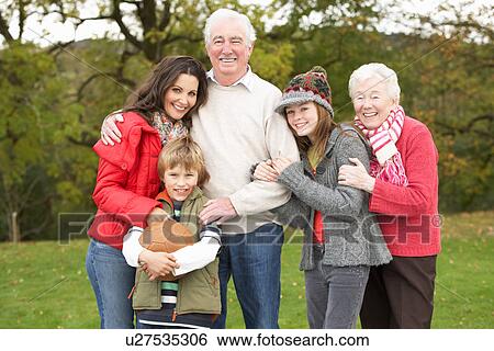 Grandparents With Grandchildren And Mother Holding Football Outside View Large Photo Image Stock Photograph - Grandparents With Grandchildren And Mother Holding Football Outside. Fotosearch