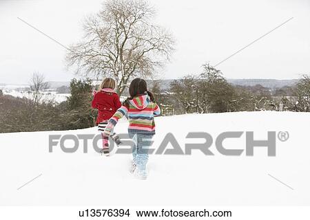 Picture - Group Of Children Having Fun In Snowy Countryside. Fotosearch