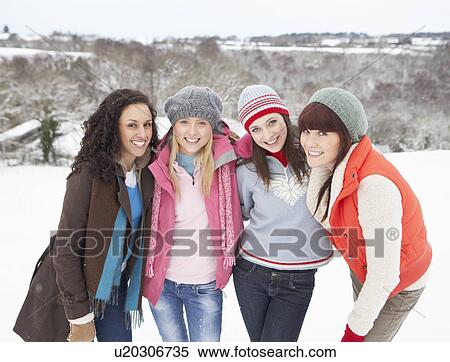 Stock Photography - Group Of Female Friends Having Fun In Snowy Landscape. Fotosearch