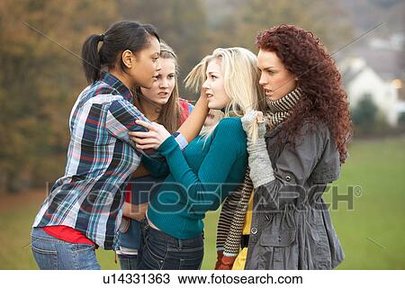 Group Of Female Teenagers Bullying Girl View Large Photo Image Stock Image - Group Of Female Teenagers Bullying Girl. Fotosearch