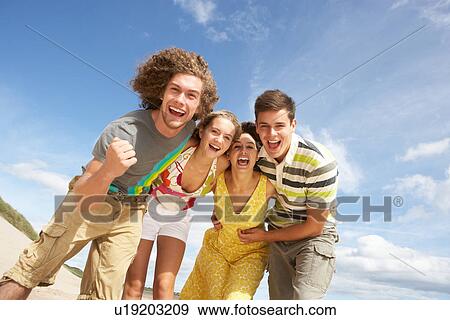 Group Of Friends Having Fun On Summer Beach View Large Photo Image Stock Photo - Group Of Friends Having Fun On Summer Beach. Fotosearch