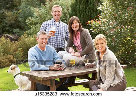 Group Of Friends Outdoors Enjoying Drink In Pub Garden View Large Photo Image Stock Image - Group Of Friends Outdoors Enjoying Drink In Pub Garden. Fotosearch