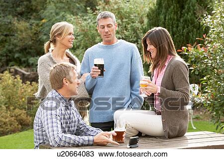 Group Of Friends Outdoors Enjoying Drink In Pub Garden View Large Photo Image Stock Image - Group Of Friends Outdoors Enjoying Drink In Pub Garden. Fotosearch