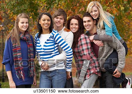 Group Of Six Teenage Friends Having Fun In Autumn Park View Large Photo Image Stock Image - Group Of Six Teenage Friends Having Fun In Autumn Park. Fotosearch