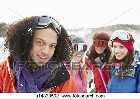 Group Of Teenage Friends Having Fun In Snowy Landscape Wearing Ski Clothing View Large Photo Image Stock Image - Group Of Teenage Friends Having Fun In Snowy Landscape Wearing Ski Clothing. Fotosearch