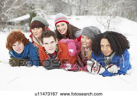 Group Of Teenage Friends Having Fun In Snowy Landscape View Large Photo Image Stock Photo - Group Of Teenage Friends Having Fun In Snowy Landscape. Fotosearch