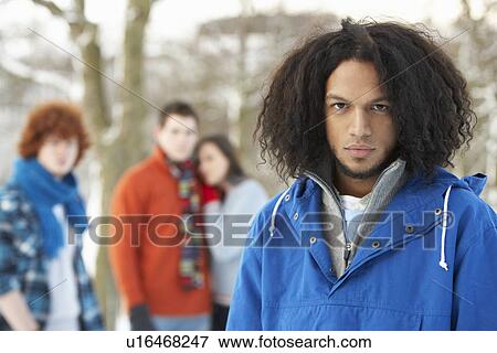 Group Of Teenage Friends Having Fun In Snowy Landscape Wearing Ski Clothing View Large Photo Image Stock Photo - Group Of Teenage Friends Having Fun In Snowy Landscape Wearing Ski Clothing. Fotosearch