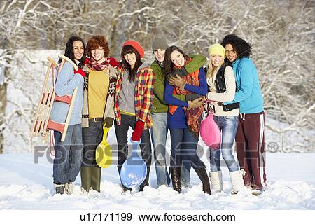 Group Of Teenage Friends Having Fun In Snowy Landscape View Large Photo Image Stock Photo - Group Of Teenage Friends Having Fun In Snowy Landscape. Fotosearch