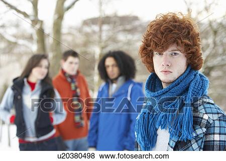 Group Of Teenage Friends Having Fun In Snowy Landscape Wearing Ski Clothing View Large Photo Image Stock Photo - Group Of Teenage Friends Having Fun In Snowy Landscape Wearing Ski Clothing. Fotosearch