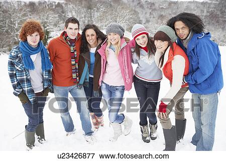 Group Of Teenage Friends Having Fun In Snowy Landscape View Large Photo Image Stock Photo - Group Of Teenage Friends Having Fun In Snowy Landscape. Fotosearch