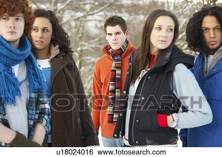 Group Of Teenage Friends Having Fun In Snowy Landscape Wearing Ski Clothing View Large Photo Image Stock Photograph - Group Of Teenage Friends Having Fun In Snowy Landscape Wearing Ski Clothing. Fotosearch