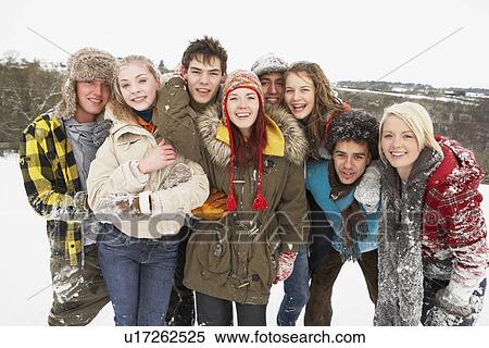 Stock Photography - Group Of Teenage Friends Having Fun In Snowy Landscape. Fotosearch