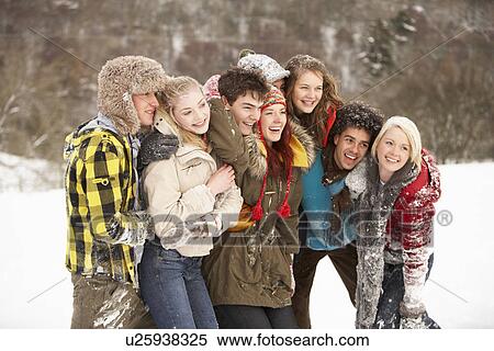 Stock Photography - Group Of Teenage Friends Having Fun In Snowy Landscape. Fotosearch