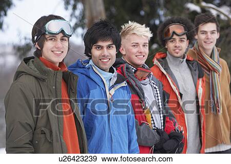 Group Of Teenage Friends In Snowy Winter Landscape View Large Photo Image Stock Photo - Group Of Teenage Friends In Snowy Winter Landscape. Fotosearch