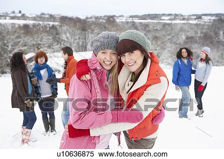 Group Of Young Friends Having Fun In Snowy Landscape View Large Photo Image Stock Photography - Group Of Young Friends Having Fun In Snowy Landscape. Fotosearch