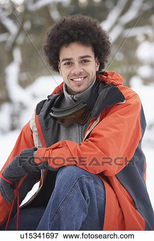 Stock Photo - Man Wearing Winter Clothes In Snowy Landscape. Fotosearch