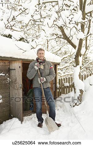 Middle Aged Man Clearing Snow From Path To Wooden Store View Large Photo Image Picture - Middle Aged Man Clearing Snow From Path To Wooden Store. Fotosearch