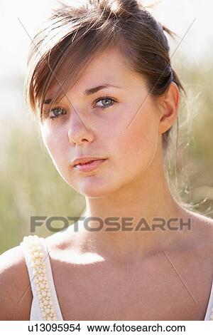 Portrait Of Beautiful Young Woman Relaxing On Beach View Large Photo Image Picture - Portrait Of Beautiful Young Woman Relaxing On Beach. Fotosearch